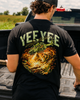 Person wearing a black t-shirt with 'YEE YEE' design in a truck bed